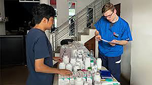 Thomas Bonifield distributing medication on a medical mission trip.