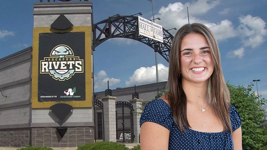 Emily Tuttle in front of the Rockford Rivets Stadium.