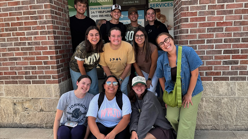 Molly Miller (front row standing) and many of the interns served at a pregnancy resource center as part of their summer internship with the church.
