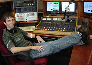 A young Rudy Haerr lounges in the control booth at WCDR radio.