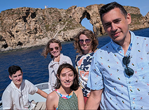 The White family aboard a boat in blue water.