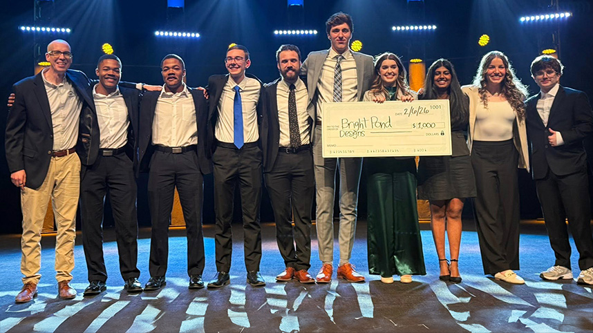 Dr. Kary Oberbrunner on the chapel stage with winners of the 2026 Pitch Competition.