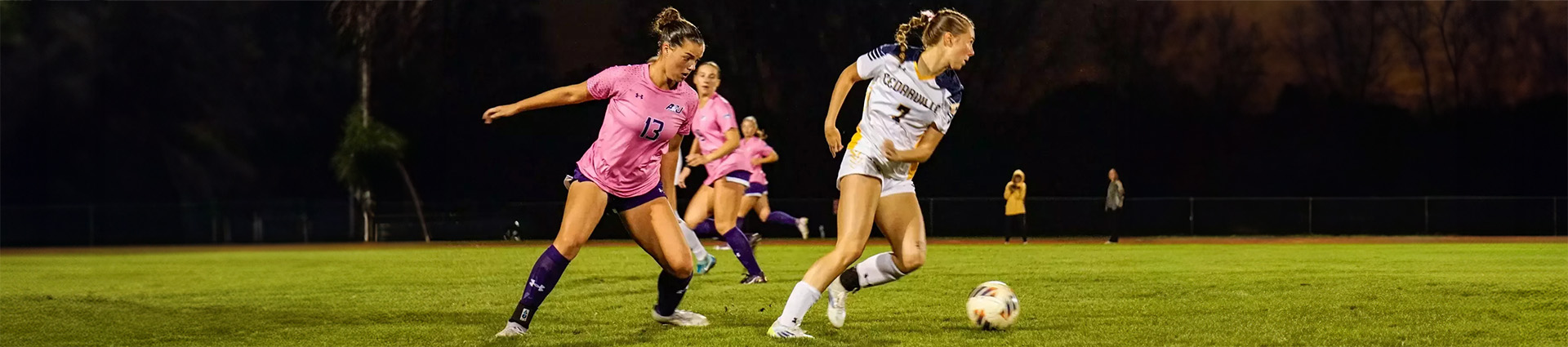 Women playing soccer during a match at Cedarville University.