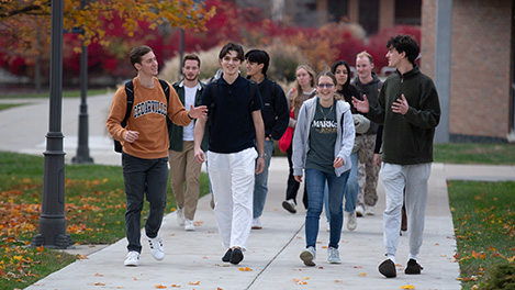 students walking and talking in the fall