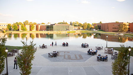 Student Center Patio, lake, and campus buildings