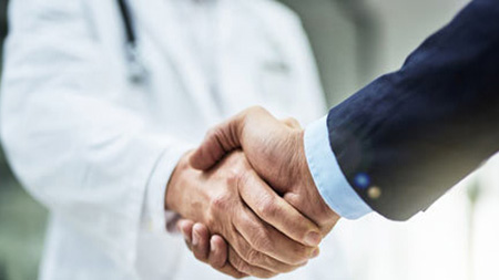 Pharmacy partners shaking hands