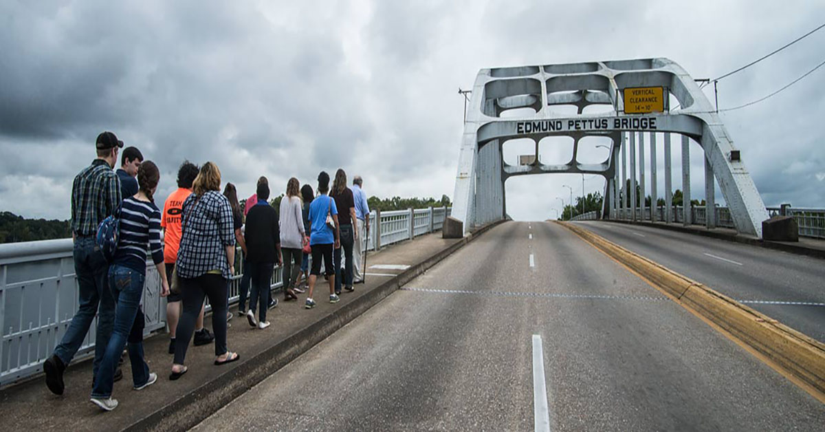 Students walking across the Edmund Pettus Bridge 