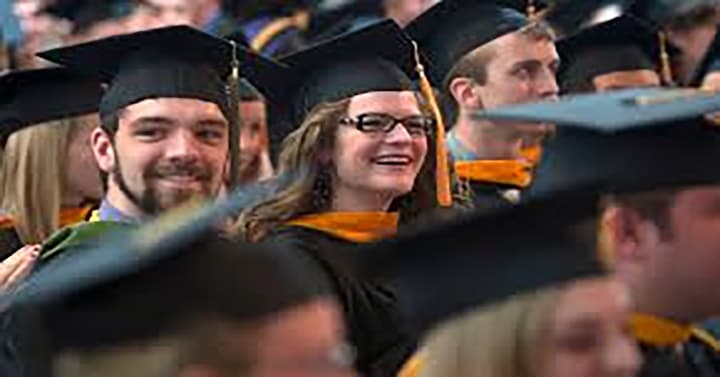 Graduate smiling during ceremony
