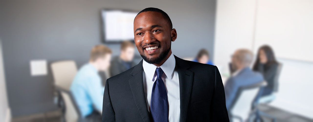 Male MBA student stands in office