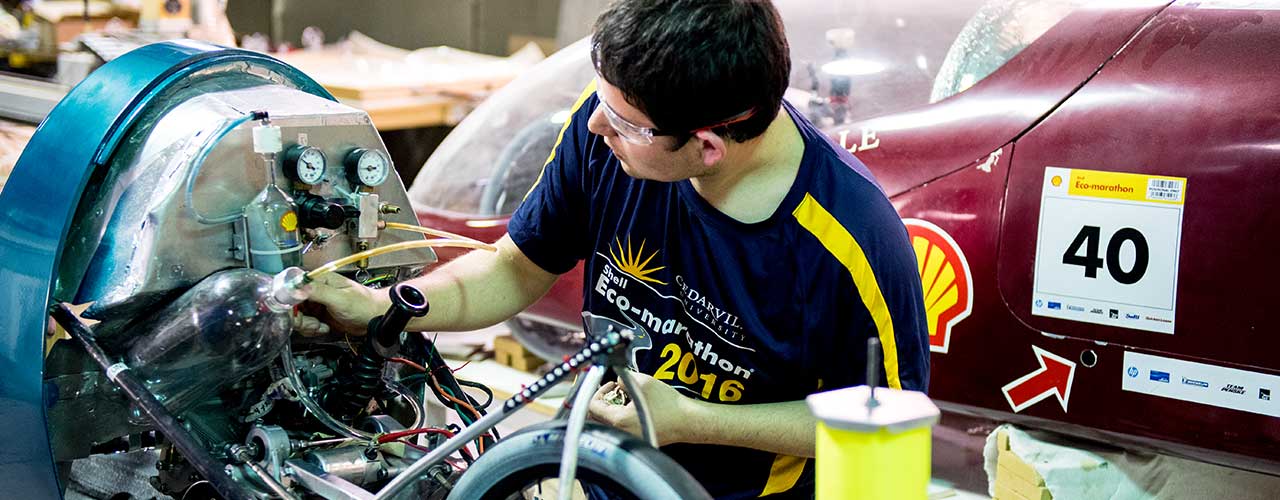 Male engineering student working on a supermileage car in Cedarville's Engineering Projects Lab