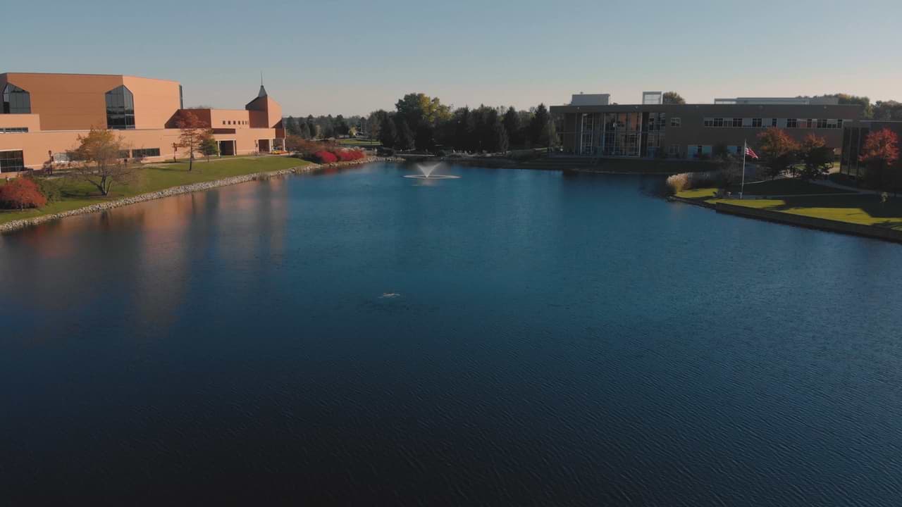 Arial view of campus overlooking the lake with the DMC on the left and the BTS on the right