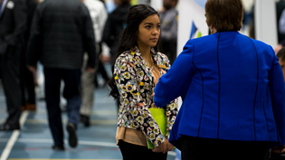 A female student talks with a potential employer at one of Cedarville's career fairs