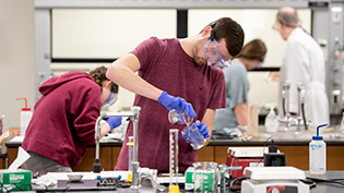 Student performs a chemistry experiment in Cedarville's state of the art chemistry labs.