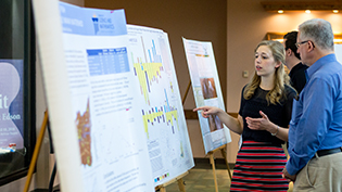 Student presents her research to a judge