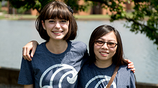 Two female students wearing Cove t-shirts