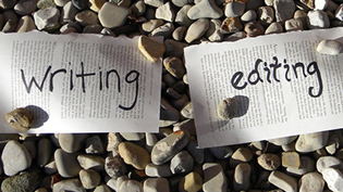 Paper saying writing and editing on rocks