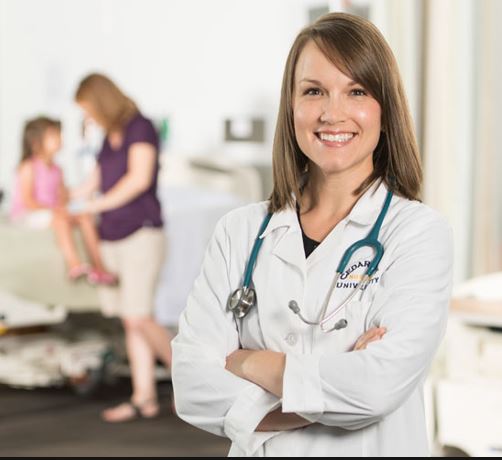 Nurse practitioner standing in front of patient