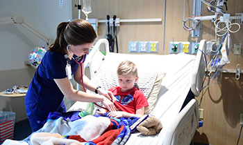 Nurse caring for a child in hospital
