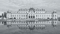 European palace reflecting in a lake.