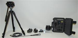 Camera on tripod and a case with various lenses