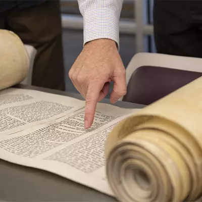 Torah scroll on a table.