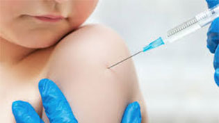 Child receiving a vaccine in his shoulder