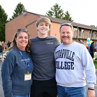 Parents with their son at the Homecoming parade