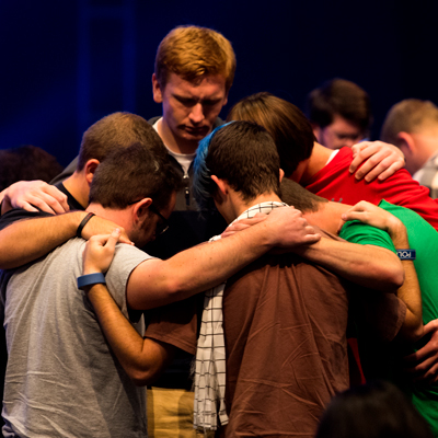 Group of students prays together