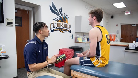 Athletic training student with athlete