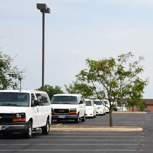 Cedarville University fleet vans parked bumper to bumper
