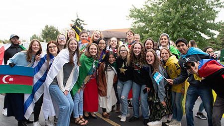 International Students posing in the homecoming parade