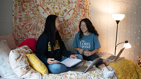Students talking in dorm room